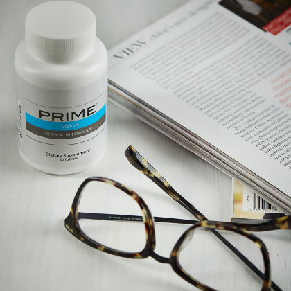 Prime Vision Eye Health Formula, next to book and reading glasses