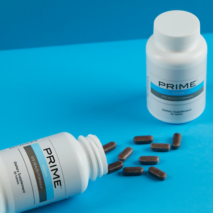 Prime Vision Eye Health Formula, with cablets spilling onto blue table