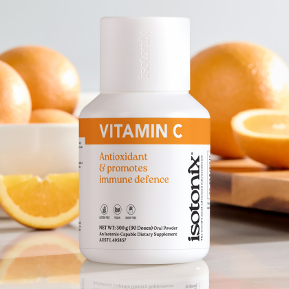 image of Isotonix Vitamin C with cut oranges