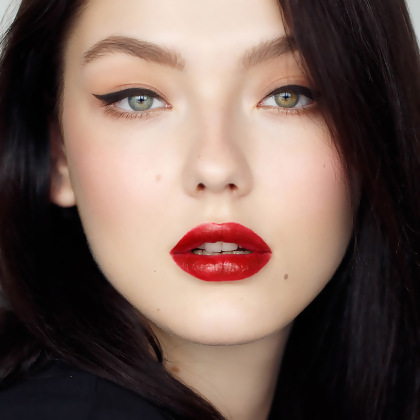 Model front facing showing Motives Precisely The Point Eye Line, with completed Motives makeup