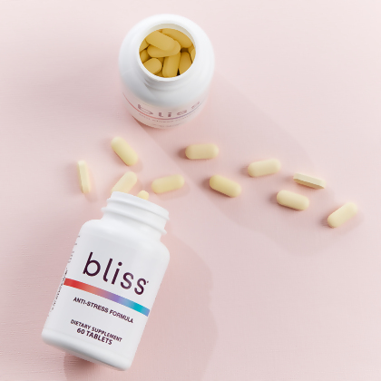 Bliss Anti-Stress Formula bottles, with caplets spillng out