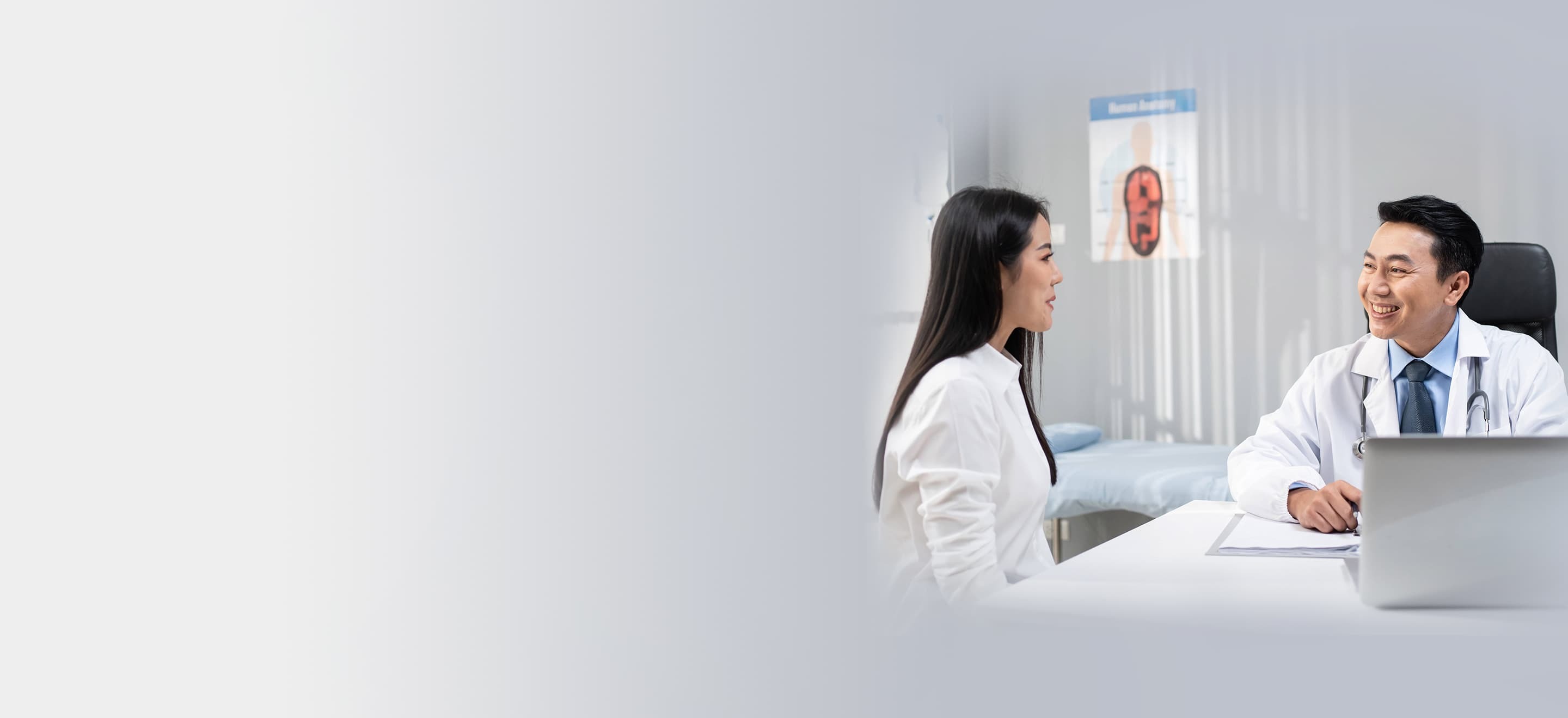 Woman being instructed by fitness trainer