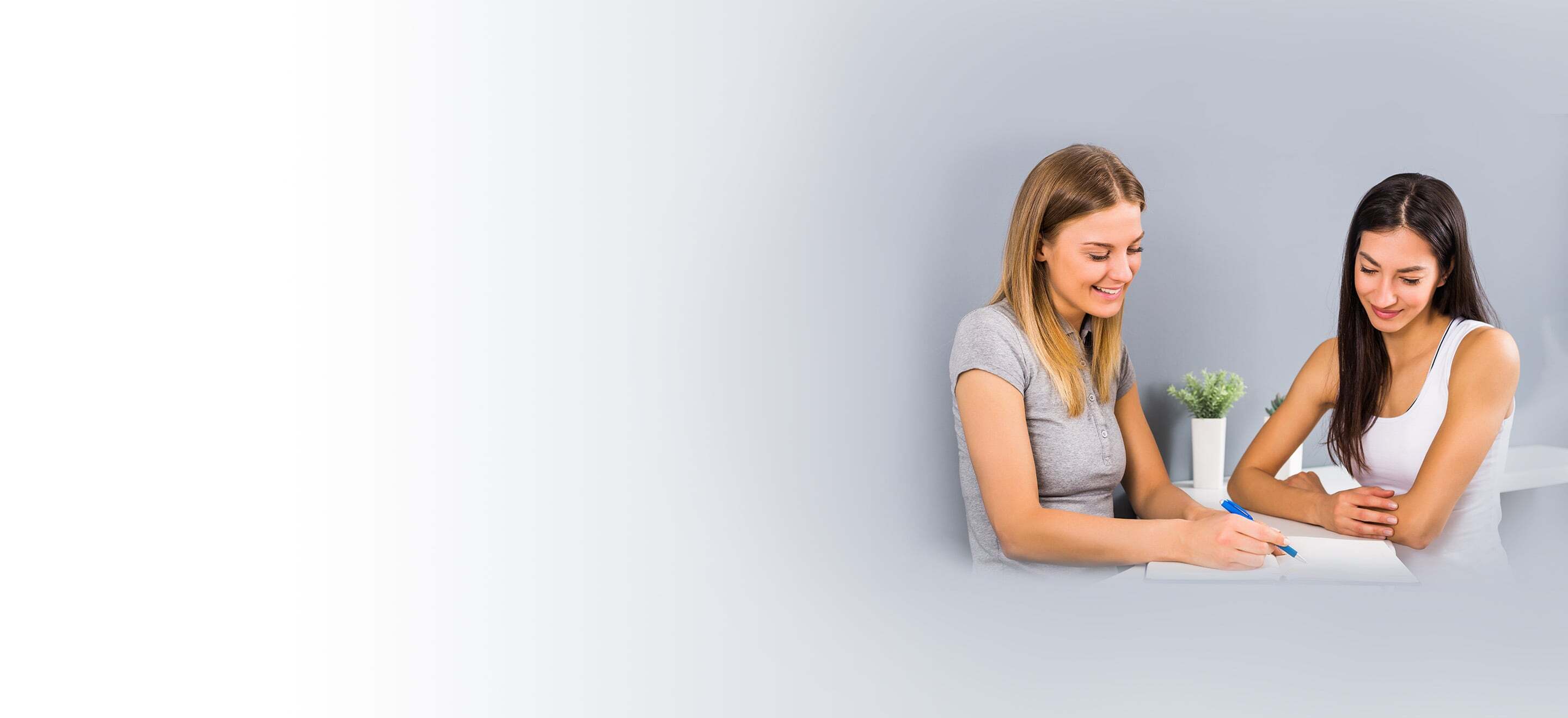 Woman being instructed by fitness trainer